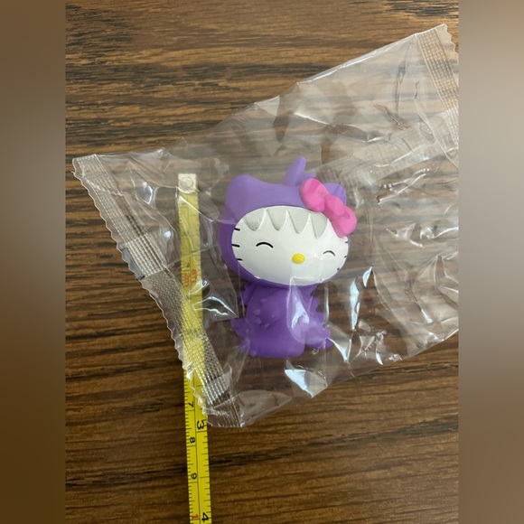 Hello Kitty Other - Hello kitty dinosaur purple plastic figure new in packaging 2 inch
